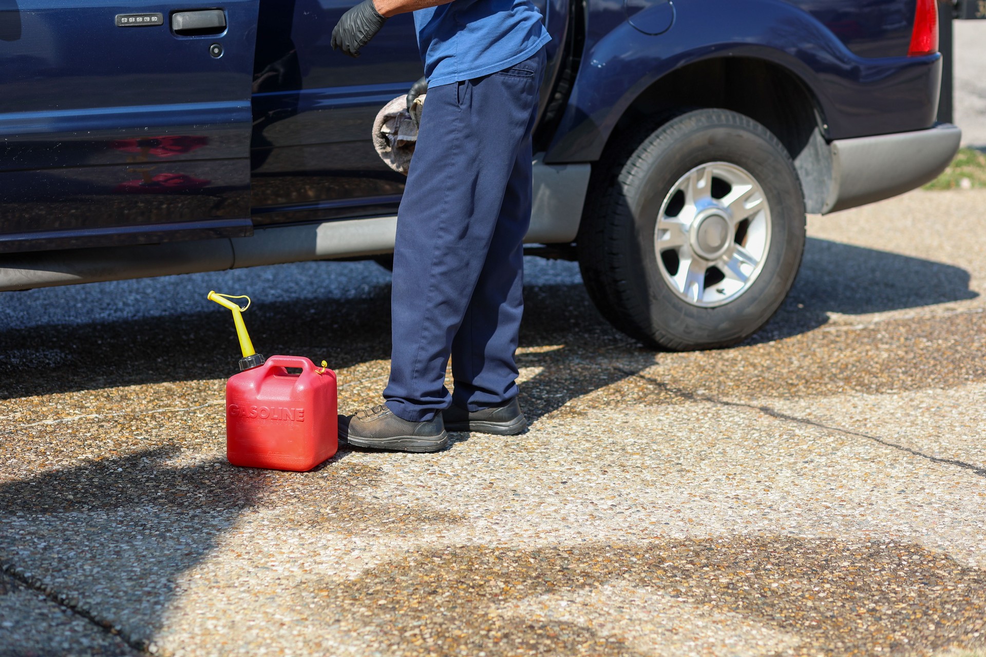 A black man holding a gas canister